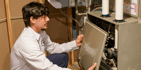 Jack Harrison HVAC technician performing furnace repair in Olathe, Kansas.